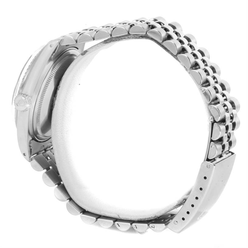 The image shows a side angle of the Rolex Vintage Collection 16014 Men's Stainless Steel Silver Dial 16014 Men's Stainless Steel Silver Dial watch, focusing on its metal bracelet and case.