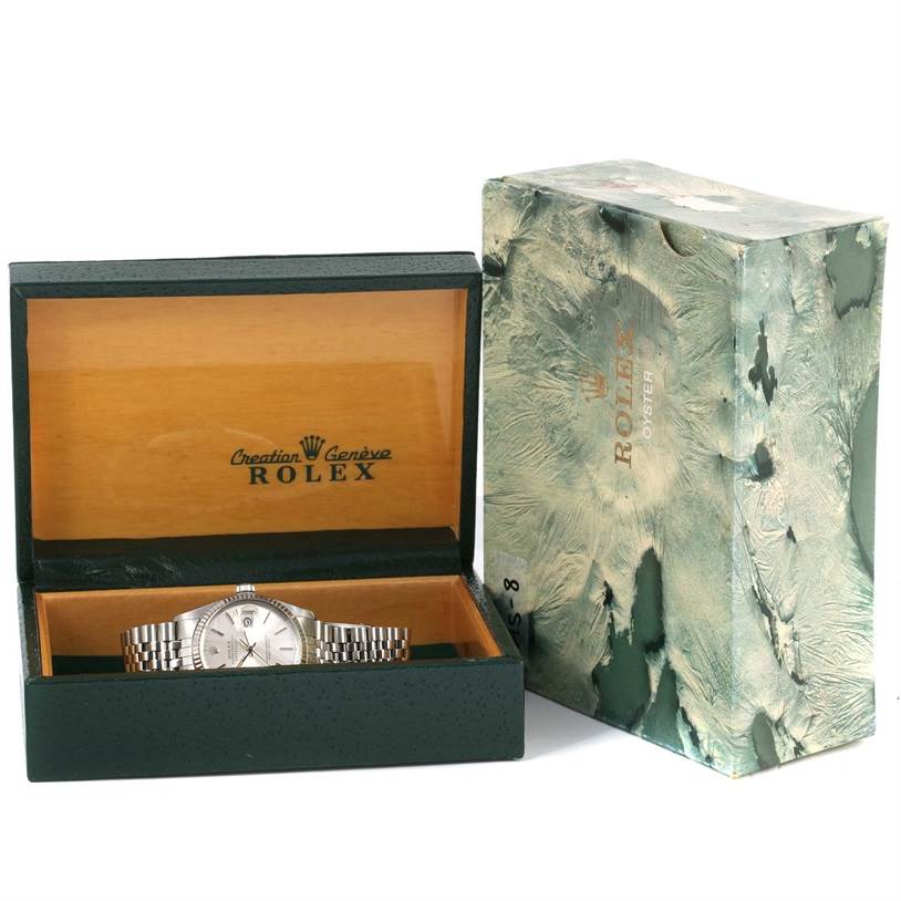 The image shows a Rolex Vintage Collection 16014 Men's Stainless Steel Silver Dial 16014 Men's Stainless Steel Silver Dial watch in an open wooden box, with an outer textured box beside it.