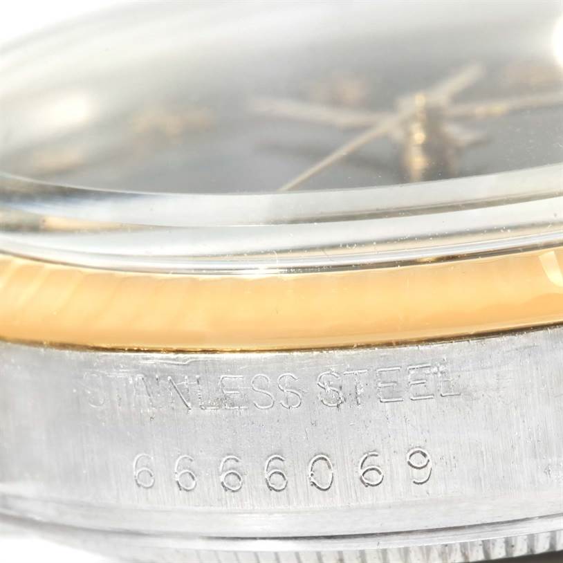 The image shows a close-up side view of the Rolex Vintage Collection 16013 Men's Stainless Steel Black Dial 16013 Men's Stainless Steel Black Dial watch, highlighting the stainless steel casing and part of the dial.