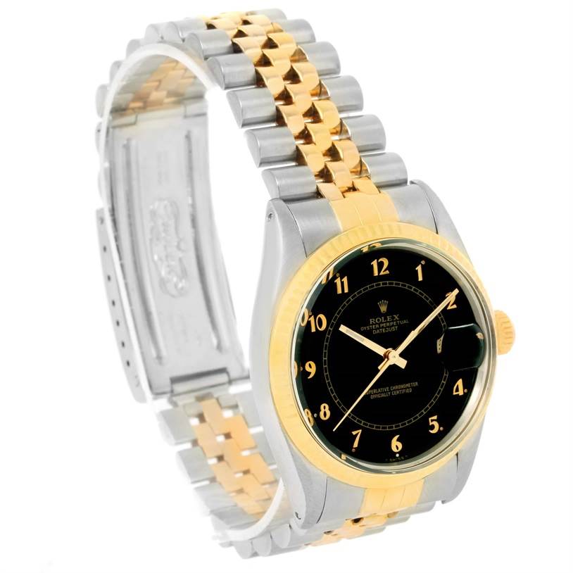 This image shows a side angle of a Rolex Vintage Collection 16013 Men's Stainless Steel Black Dial 16013 Men's Stainless Steel Black Dial watch, revealing its black dial, gold bezel, and two-tone metal bracelet.