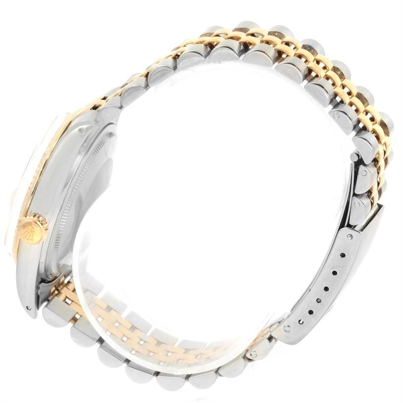 The image shows the side view and band of the Rolex Vintage Collection 16013 Men's Stainless Steel Black Dial 16013 Men's Stainless Steel Black Dial watch, highlighting the two-tone bracelet and crown.