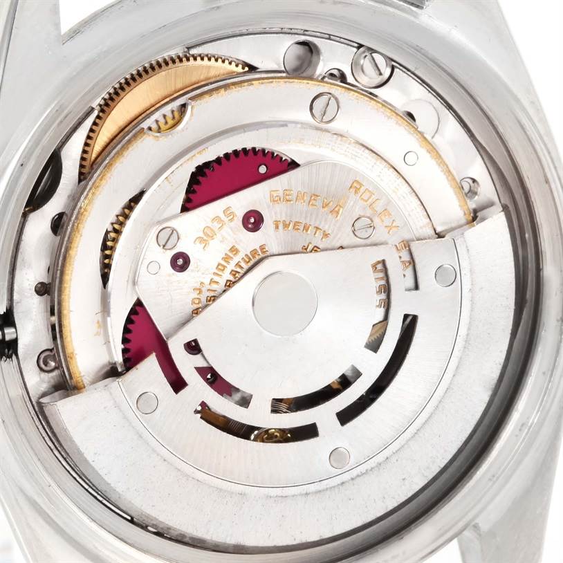 The image shows the intricate movement mechanism of a Vintage Collection Rolex watch from a top-down angle.
