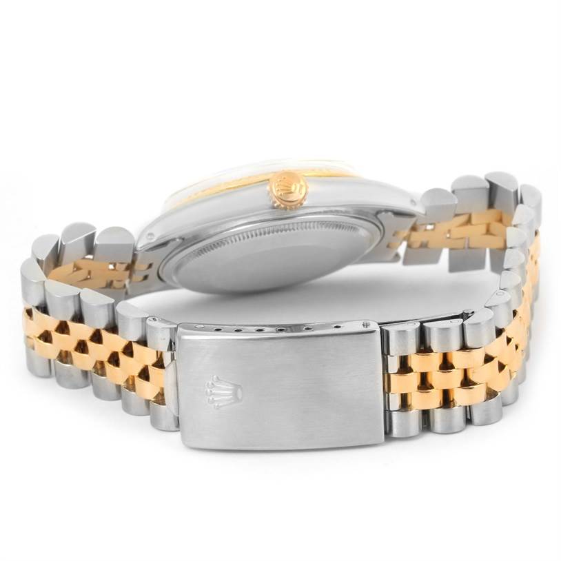 This image shows the rear view of a Rolex Vintage Collection 16013 Men's Stainless Steel Black Dial 16013 Men's Stainless Steel Black Dial watch focusing on the clasp and two-tone bracelet.