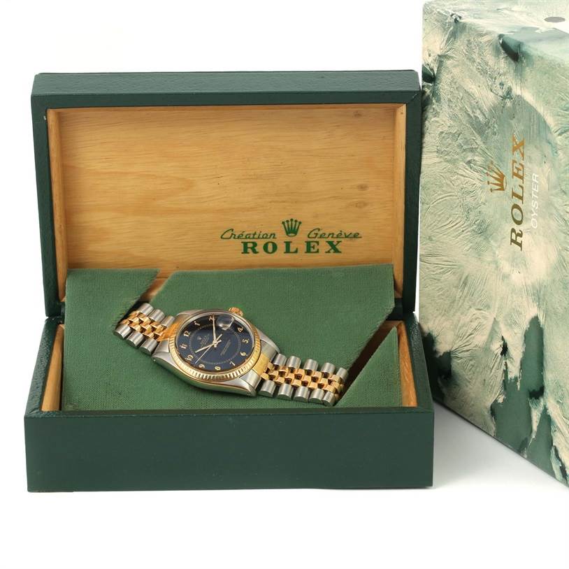 The image shows a Rolex Vintage Collection 16013 Men's Stainless Steel Black Dial 16013 Men's Stainless Steel Black Dial watch from a front angle, inside its original green and wood-grain box.