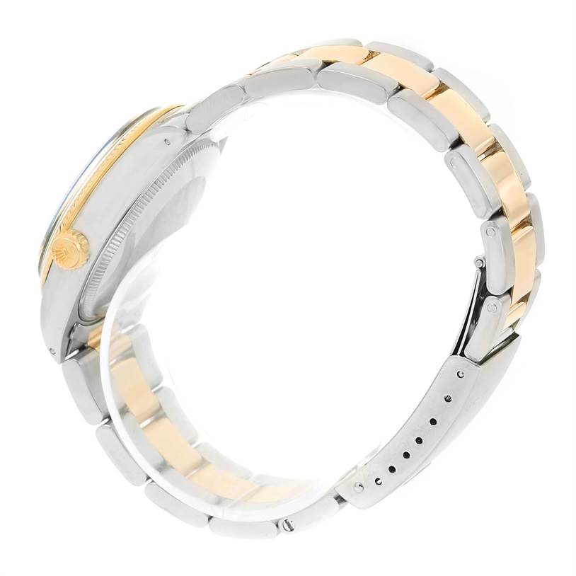 This side-angle view shows the band, crown, and part of the case of the Rolex Vintage Collection 1005 Men's Steel and Gold (two tone) Champagne Dial 1005 Men's Steel and Gold (two tone) Champagne Dial model watch.