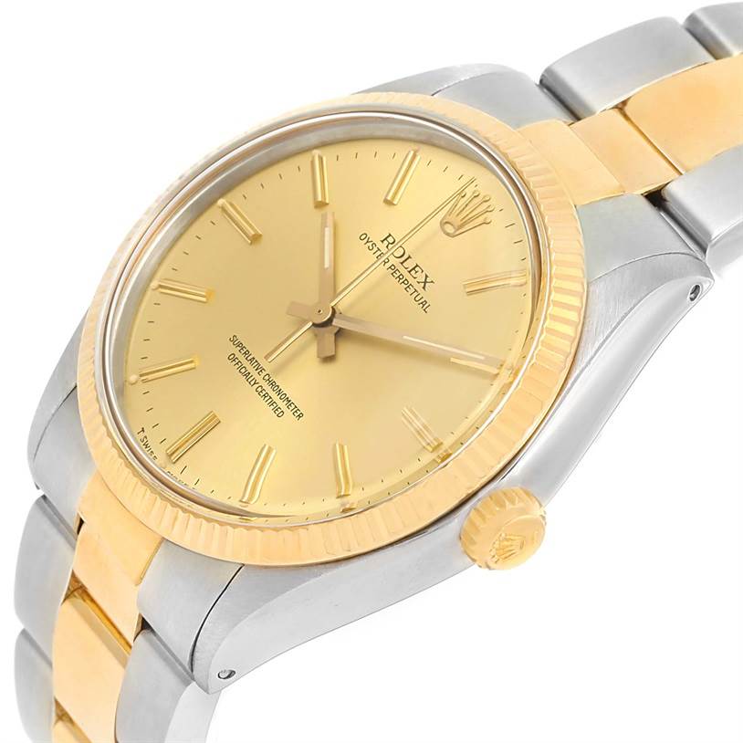 The Vintage Collection Rolex watch is shown at an angle, highlighting its gold dial, bezel, crown, and two-tone bracelet.