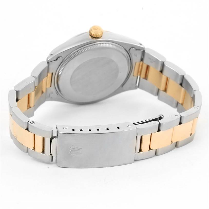 This image shows the back angle of a Rolex Vintage Collection 1005 Men's Steel and Gold (two tone) Champagne Dial 1005 Men's Steel and Gold (two tone) Champagne Dial model, highlighting its bracelet and clasp.