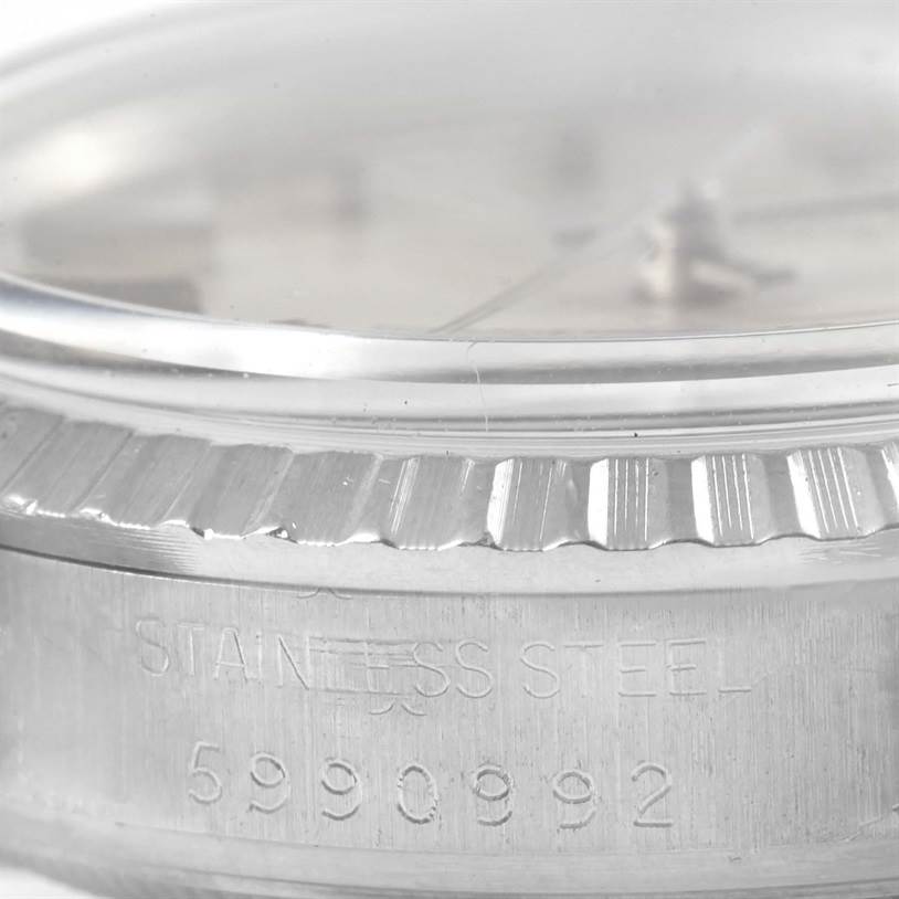 This close-up image shows the textured bezel and part of the case back, including the serial number, of the Rolex Vintage Collection 16030 Men's Stainless Steel Silver Dial 16030 Men's Stainless Steel Silver Dial watch.