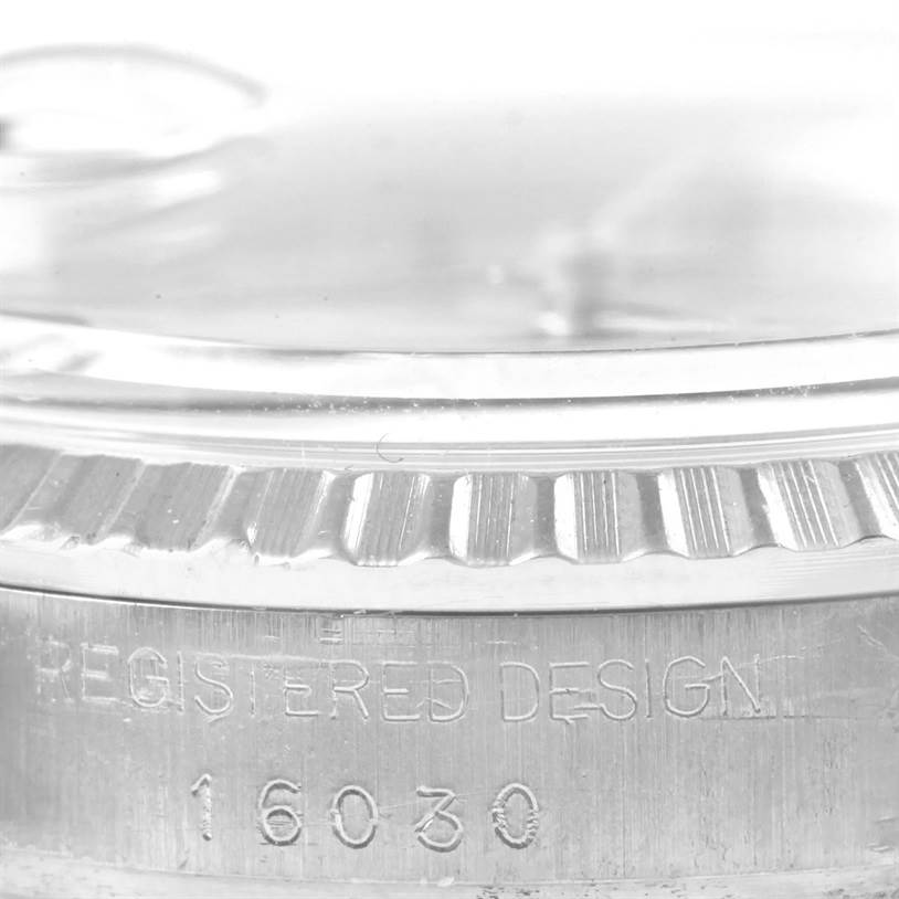 The image shows a close-up side view of the case with the reference number of a Rolex Vintage Collection 16030 Men's Stainless Steel Silver Dial 16030 Men's Stainless Steel Silver Dial model 16030.