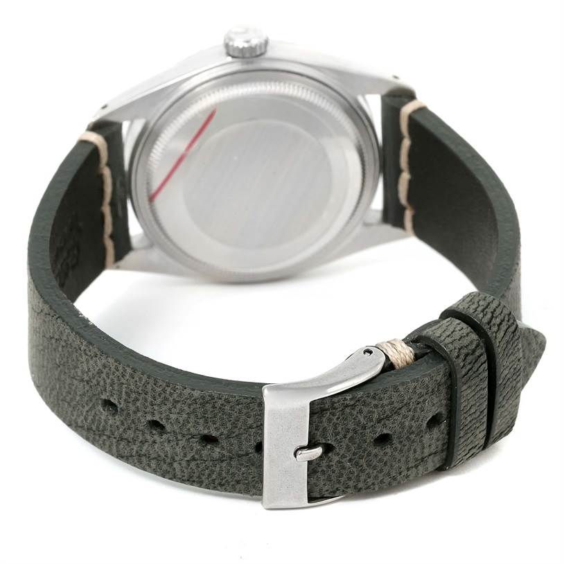 This image shows the back of the case and the leather strap with the clasp of a Vintage Collection Rolex watch.