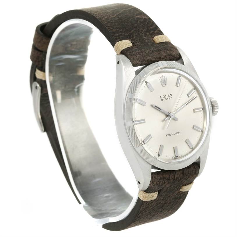 The image shows a Rolex Vintage Collection 6427 Men's Stainless Steel Silver Dial 6427 Men's Stainless Steel Silver Dial model watch at a three-quarter angle, displaying the face, bezel, crown, and leather strap.