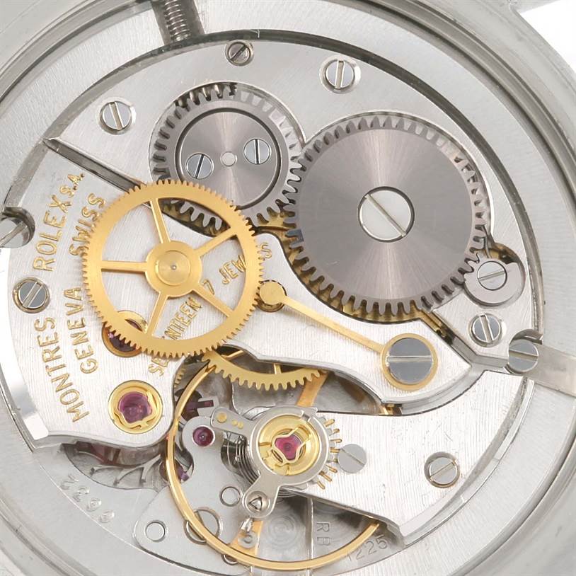 The image shows a close-up of the internal gears and mechanisms of the Vintage Collection model by Rolex.
