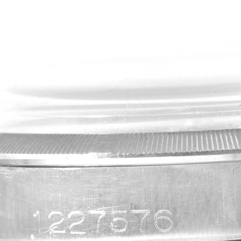 This image shows a close-up of the case side and bezel of a Rolex Vintage Collection 6427 Men's Stainless Steel Silver Dial 6427 Men's Stainless Steel Silver Dial watch, along with its engraved serial number.