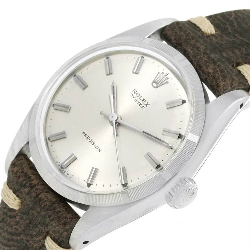 The image shows a side angle of a Rolex Vintage Collection 6427 Men's Stainless Steel Silver Dial 6427 Men's Stainless Steel Silver Dial watch, highlighting the dial, crown, and leather strap.