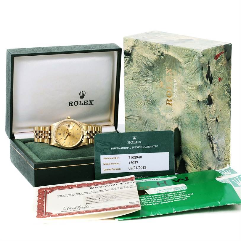 The image shows a Rolex Vintage Collection 15037 Men's Yellow Gold Champagne Dial 15037 Men's Yellow Gold Champagne Dial watch at a front angle, along with its box, guarantee card, and other documentation.