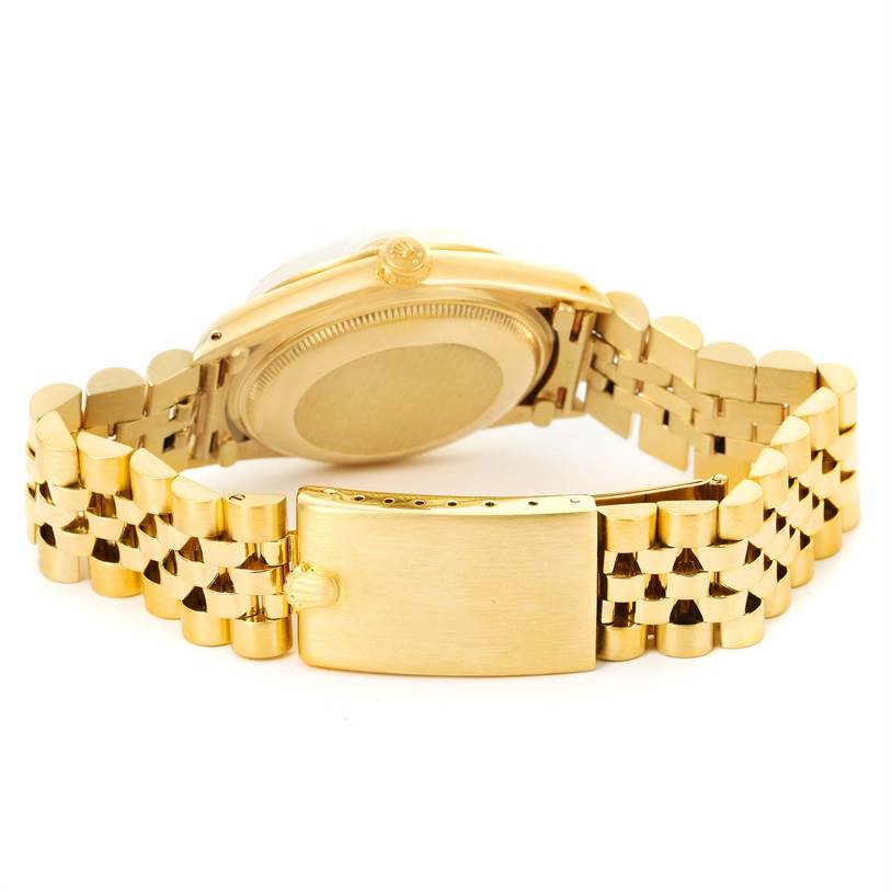 The image shows the back view of the Vintage Collection Rolex watch, focusing on the case and gold bracelet clasp.