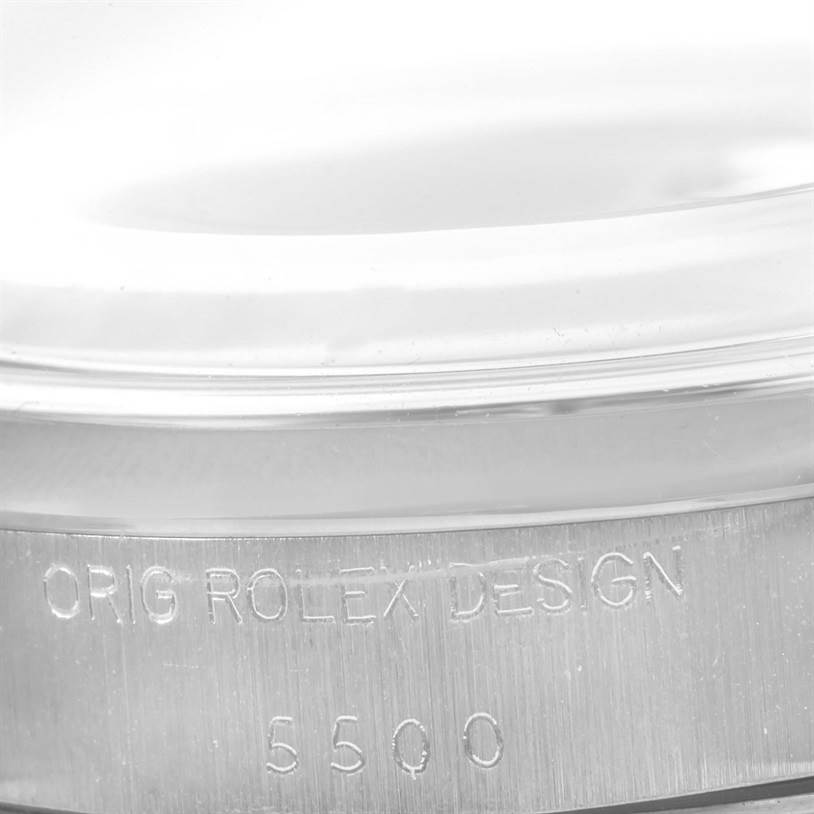 This image shows a close-up of the side of the Rolex Vintage Collection 5500 Men's Stainless Steel Silver Dial 5500 Men's Stainless Steel Silver Dial model, highlighting the "ORIG ROLEX DESIGN" and model number 5500 engraved on it.