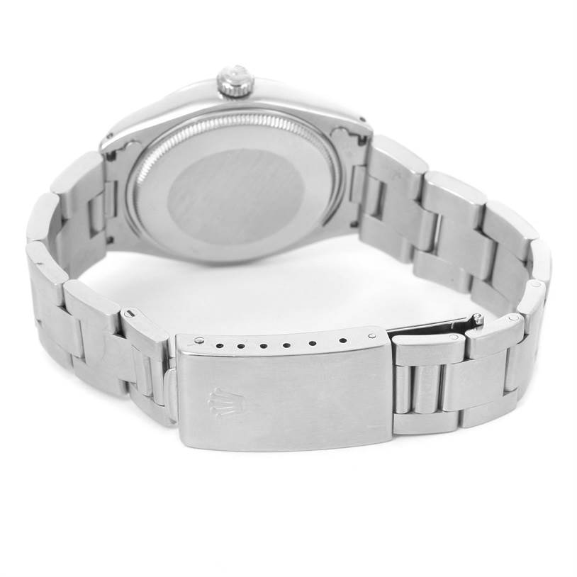 This image shows the back view of a Vintage Collection Rolex watch, highlighting the case back and the metal bracelet with clasp.