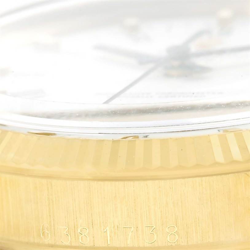 This close-up image shows the case edge and bezel of the Rolex Vintage Collection 1503 Men's Yellow Gold White Dial 1503 Men's Yellow Gold White Dial model, highlighting its serial number.