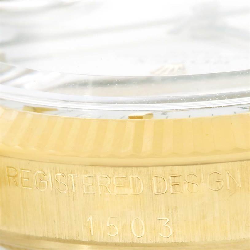 The image shows a close-up of the side view of the Rolex Vintage Collection 1503 Men's Yellow Gold White Dial 1503 Men's Yellow Gold White Dial model watch, highlighting the bezel and engraved design number.