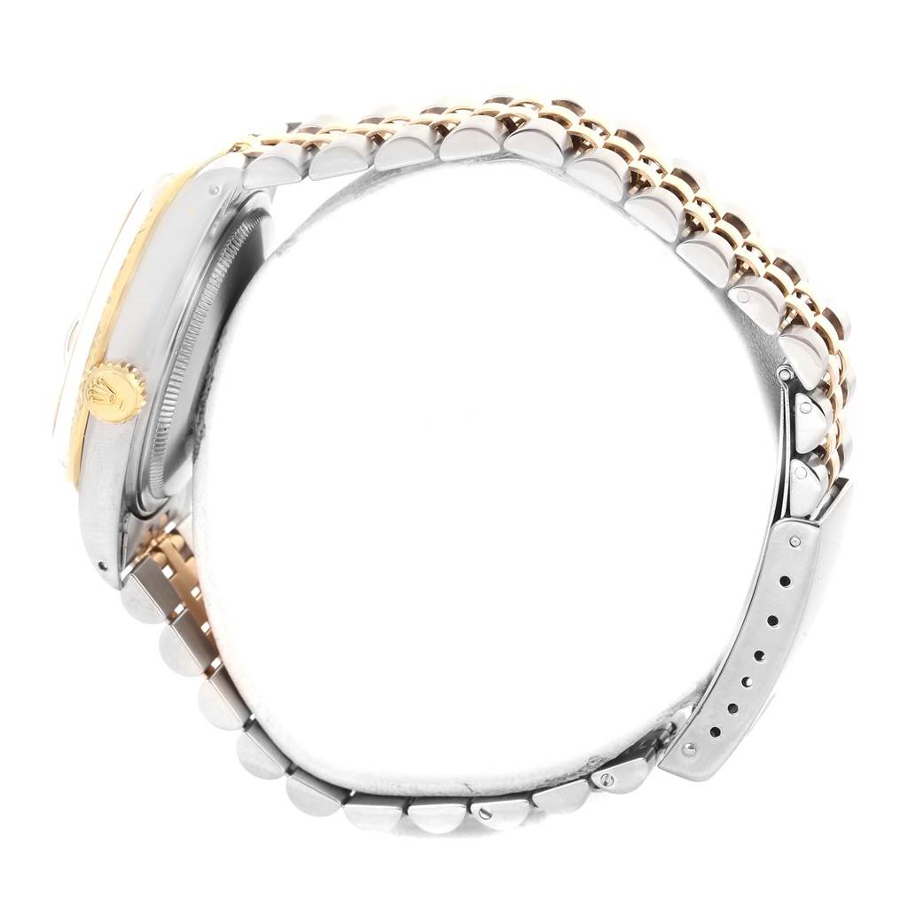 The image shows a side view of the Rolex Vintage Collection 16013 Men's Stainless Steel White Dial 16013 Men's Stainless Steel White Dial watch, focusing on its crown, case, and jubilee bracelet.