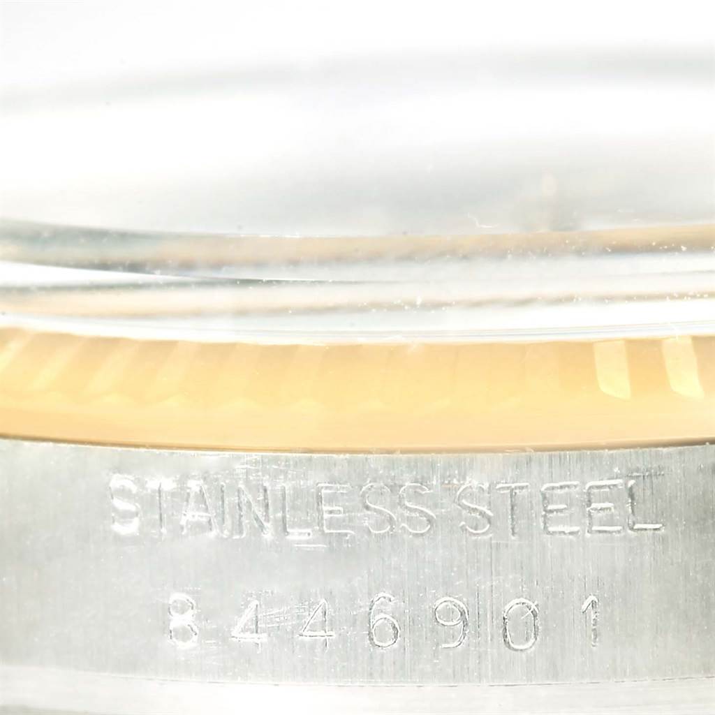 The image shows a close-up of the bezel, glass, and stainless steel case with the serial number of a Rolex Vintage Collection 16013 Men's Stainless Steel White Dial 16013 Men's Stainless Steel White Dial model.