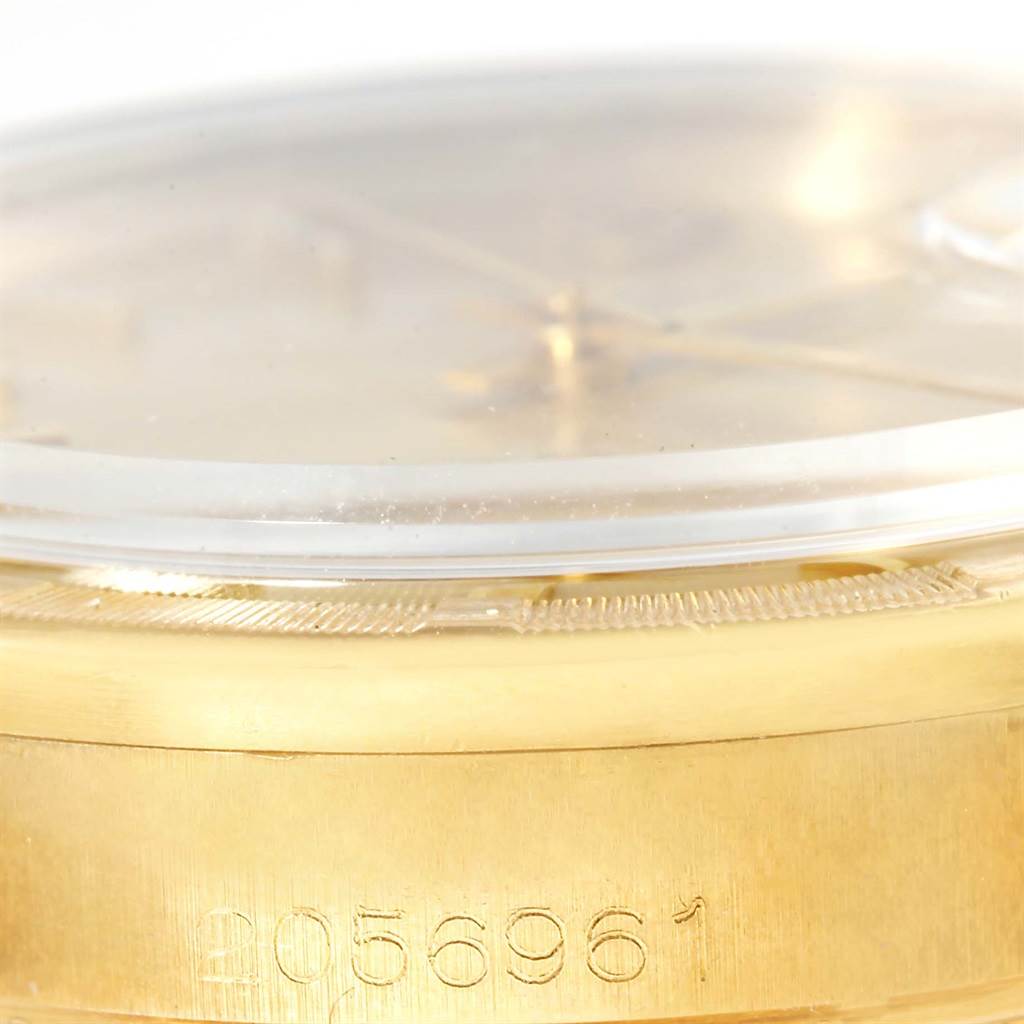 This image shows a close-up of the side view of the Rolex Vintage Collection 1500 Men's Yellow Gold Champagne Dial 1500 Men's Yellow Gold Champagne Dial model, highlighting the case and serial number.