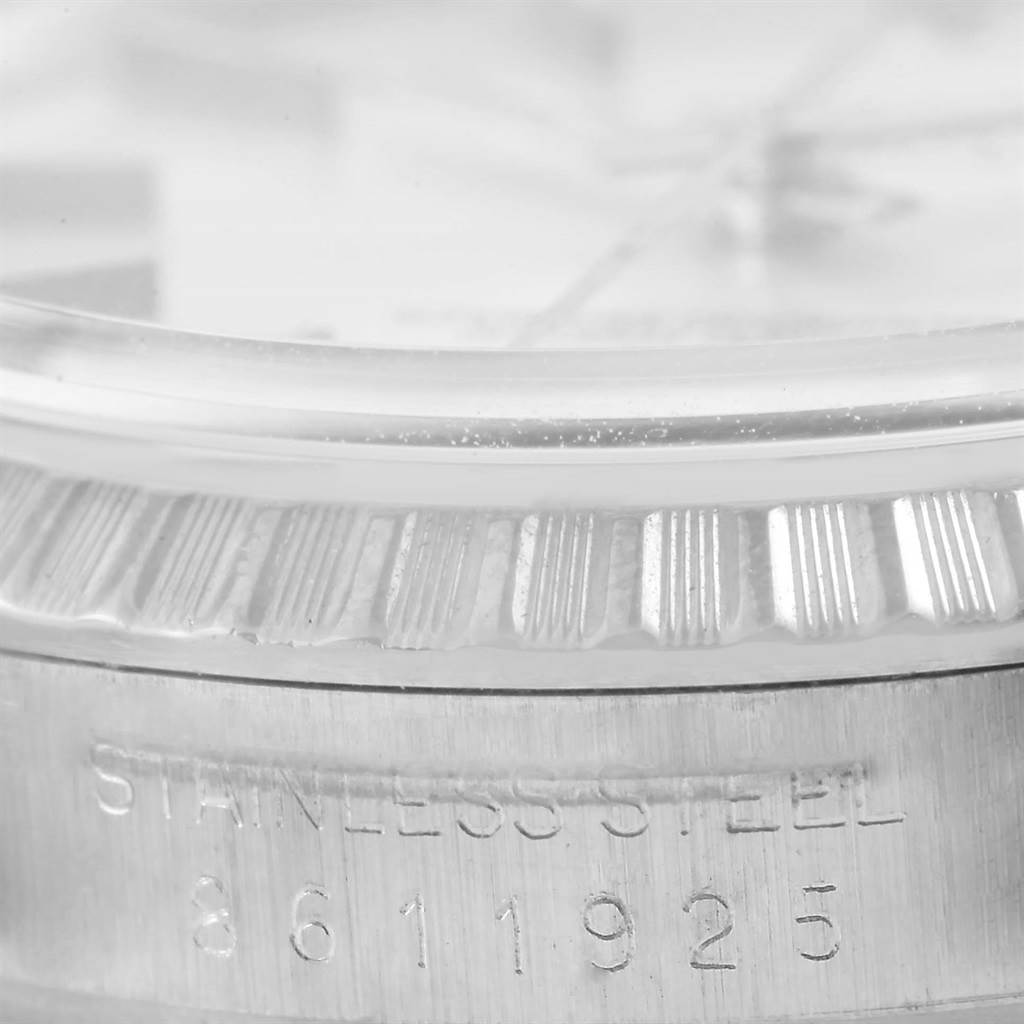 The image shows a close-up angle of the bezel and part of the case of a Rolex Vintage Collection 16030 Men's Stainless Steel Silver Dial 16030 Men's Stainless Steel Silver Dial model watch, highlighting its stainless steel construction.