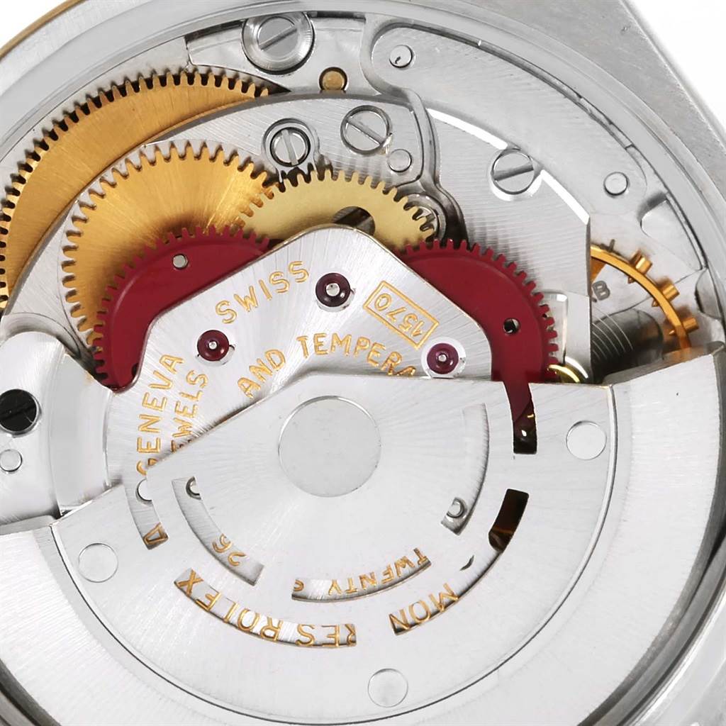 This image shows the detailed inner mechanism of a Rolex Vintage Collection 1005 Men's Steel and Gold (two tone) Champagne Dial 1005 Men's Steel and Gold (two tone) Champagne Dial watch, focusing on the gears and movement components.