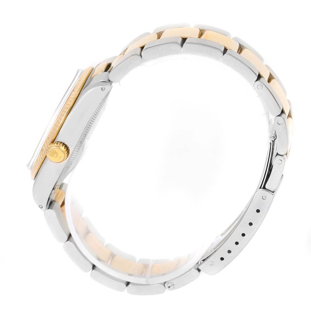 This side view image of the Rolex Vintage Collection 1005 Men's Steel and Gold (two tone) Champagne Dial 1005 Men's Steel and Gold (two tone) Champagne Dial model shows the watch case, crown, and link bracelet.