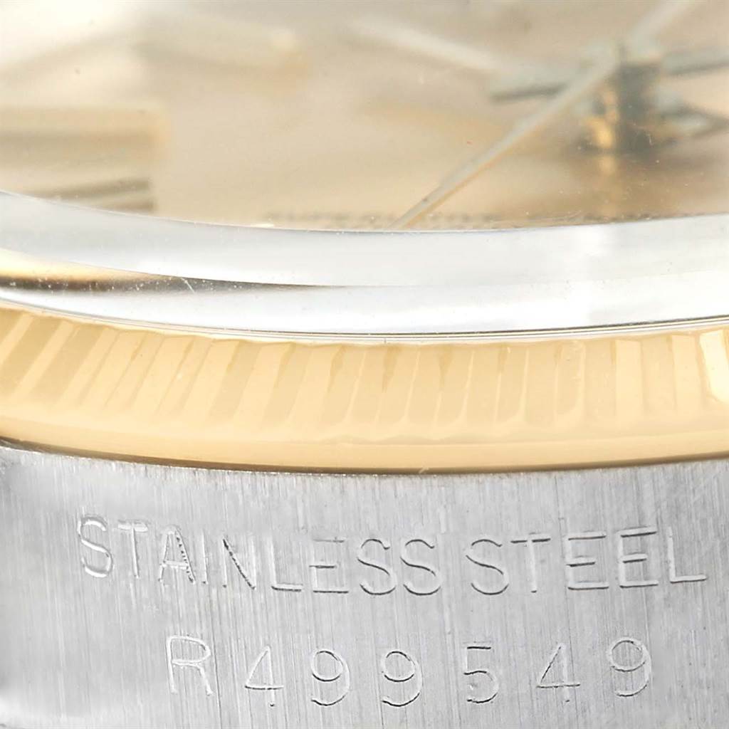 The image shows a close-up of the case side and serial number inscription of the Rolex Vintage Collection 1005 Men's Steel and Gold (two tone) Champagne Dial 1005 Men's Steel and Gold (two tone) Champagne Dial model watch.