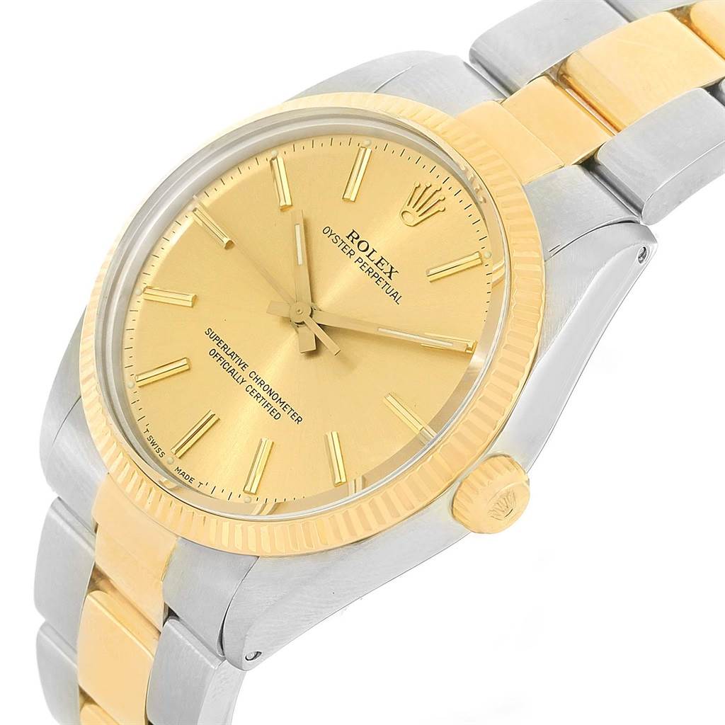 The image shows a Rolex Vintage Collection 1005 Men's Steel and Gold (two tone) Champagne Dial 1005 Men's Steel and Gold (two tone) Champagne Dial model watch from an angled side view, highlighting its gold dial, bezel, and mixed metal bracelet.