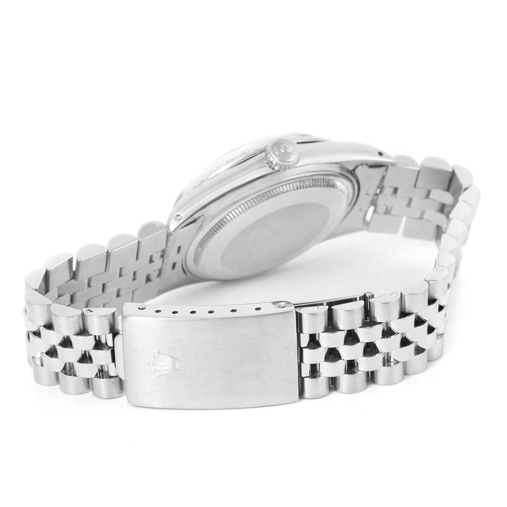 The image shows the back casing and bracelet of a Vintage Collection Rolex watch at an angled view.