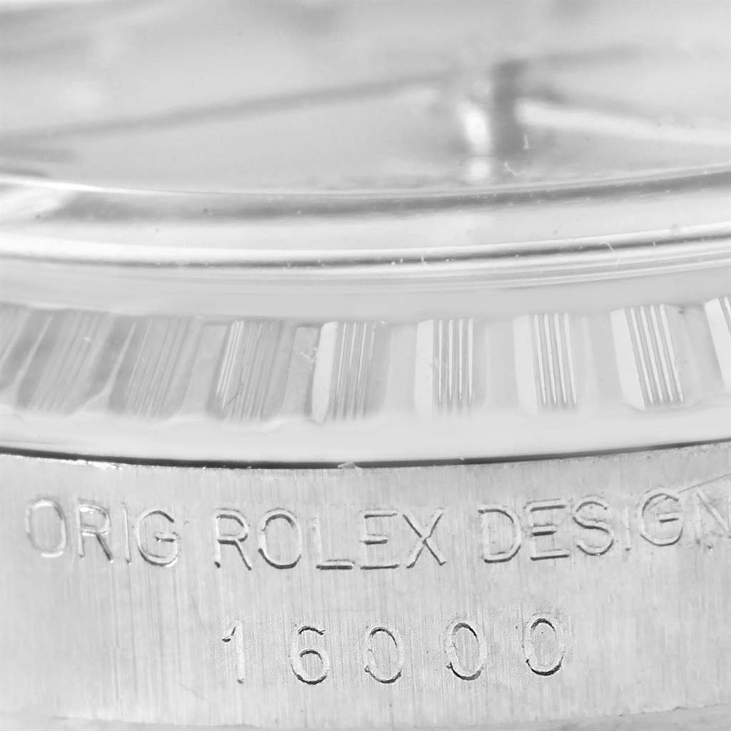 The image shows a close-up of the side of a Rolex Vintage Collection 16000 Men's Stainless Steel Silver Dial 16000 Men's Stainless Steel Silver Dial watch, specifically displaying "ORIG ROLEX DESIGN" and the model number 16000.