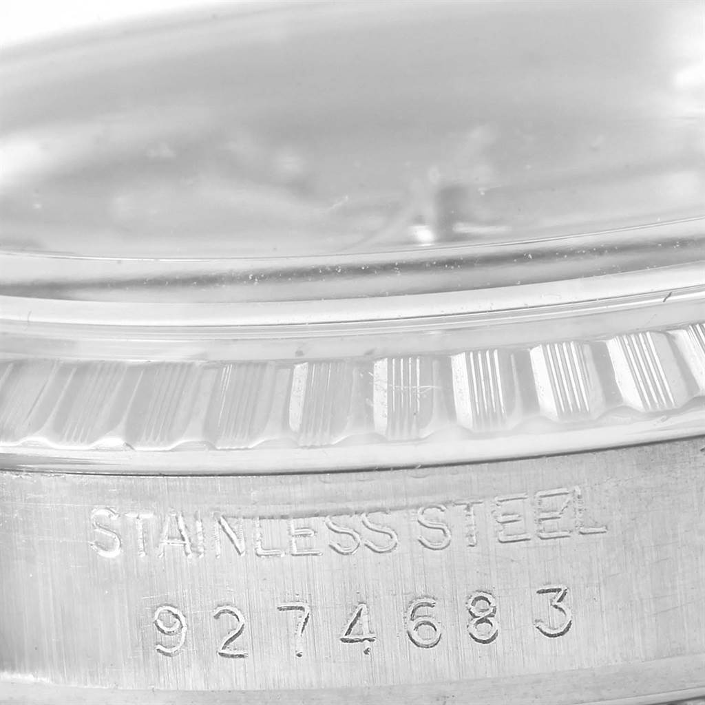 This image shows a close-up of the side of a Rolex Vintage Collection 16000 Men's Stainless Steel Silver Dial 16000 Men's Stainless Steel Silver Dial watch, focusing on the stainless steel case and serial number.