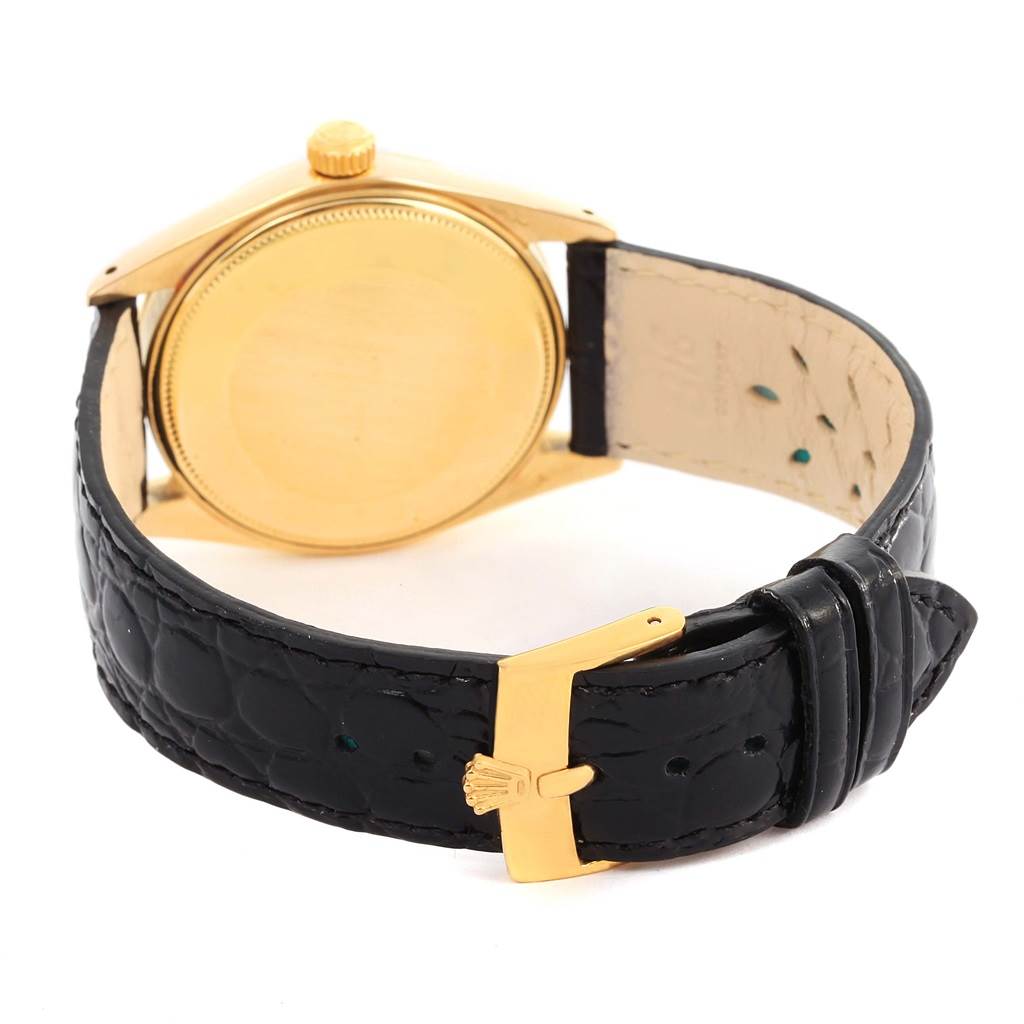 The image shows the back case and strap of a Vintage Collection Rolex watch.