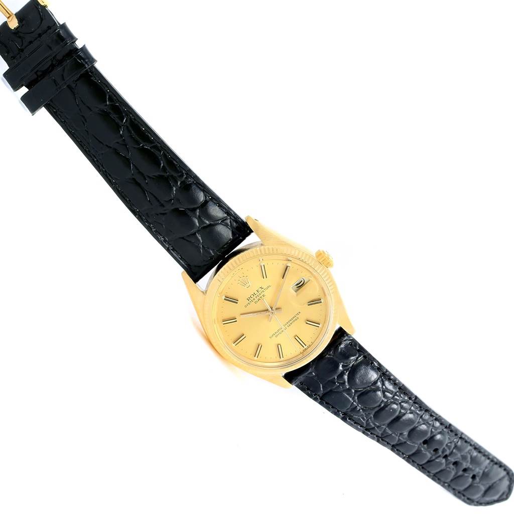 The image shows a Rolex Vintage Collection 1503 Men's Yellow Gold Champagne Dial 1503 Men's Yellow Gold Champagne Dial watch at a top-down angle, highlighting its gold case and black leather strap.