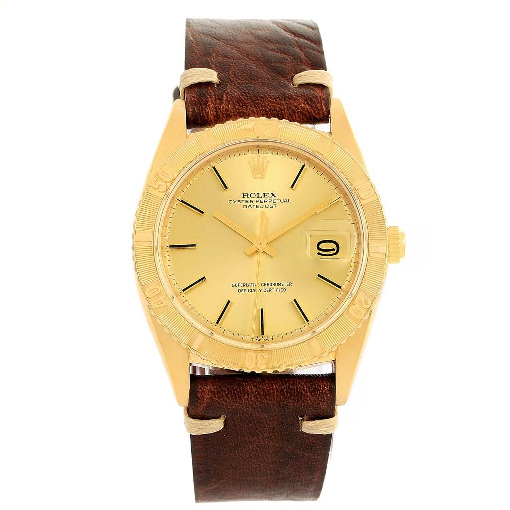 This image shows a front view of a Rolex Vintage Collection 1625 Men's Yellow Gold Champagne Dial 1625 Men's Yellow Gold Champagne Dial Oyster Perpetual Datejust watch with a brown leather strap.
