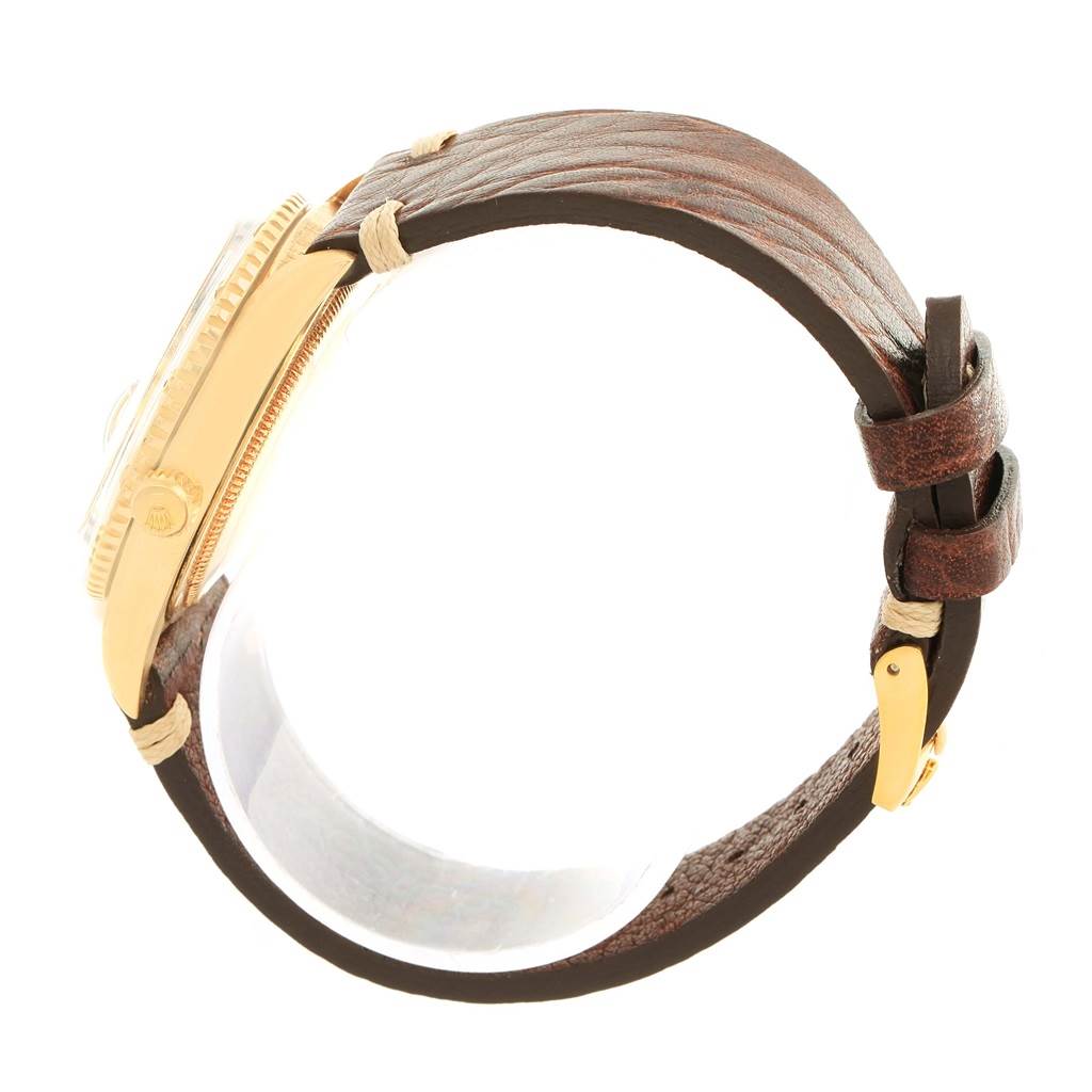 This side-angle view shows the gold case and brown leather strap of the Rolex Vintage Collection 1625 Men's Yellow Gold Champagne Dial 1625 Men's Yellow Gold Champagne Dial watch.