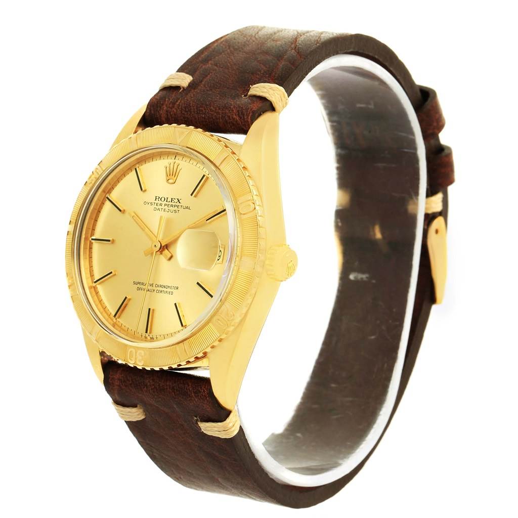The image shows a side angle of the Rolex Vintage Collection 1625 Men's Yellow Gold Champagne Dial 1625 Men's Yellow Gold Champagne Dial watch, highlighting its gold case, dial, crown, and brown leather strap.