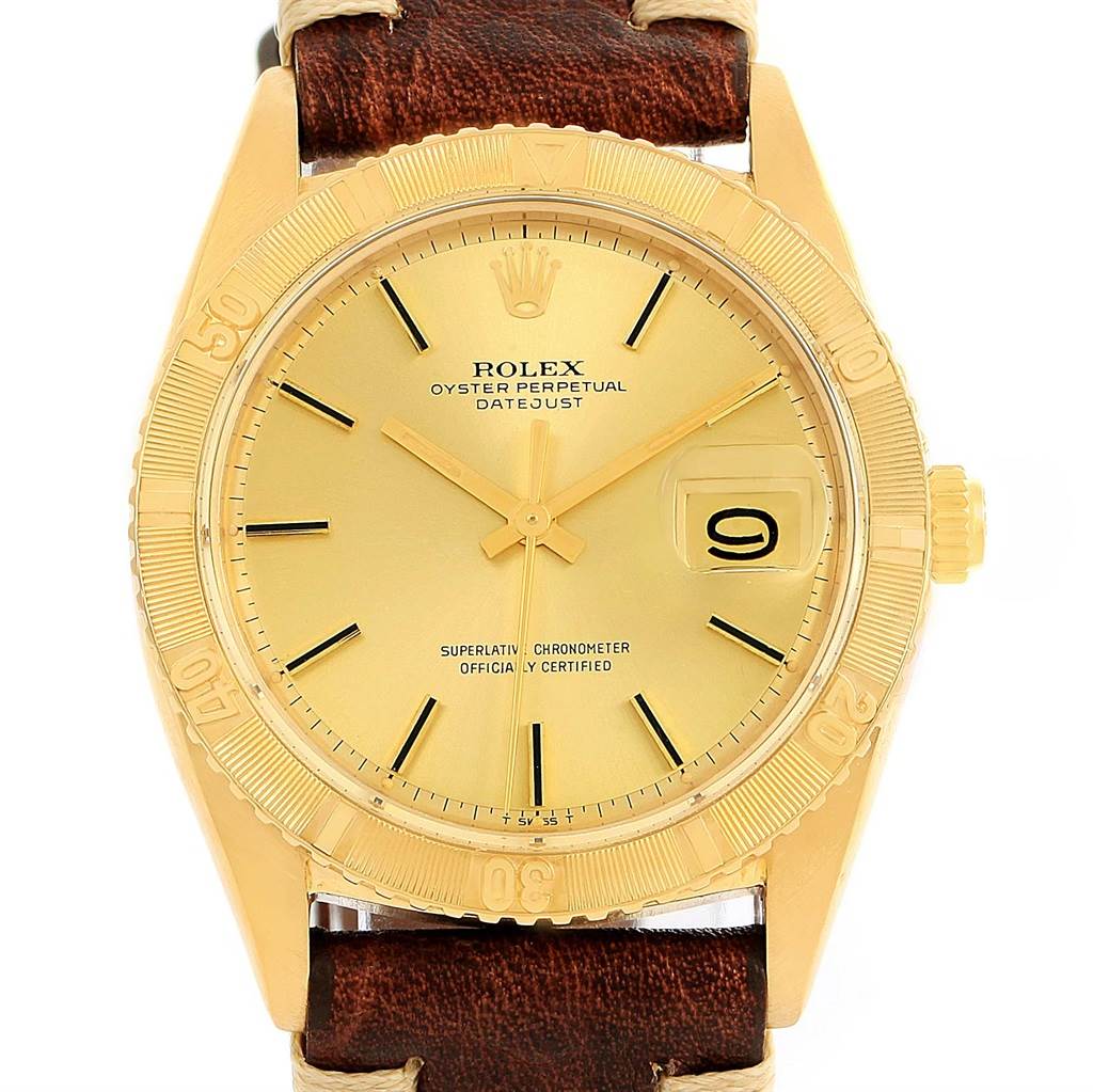 This image shows a close-up front view of a Rolex Vintage Collection 1625 Men's Yellow Gold Champagne Dial 1625 Men's Yellow Gold Champagne Dial Oyster Perpetual Datejust watch, highlighting its dial, hands, bezel, and leather strap.