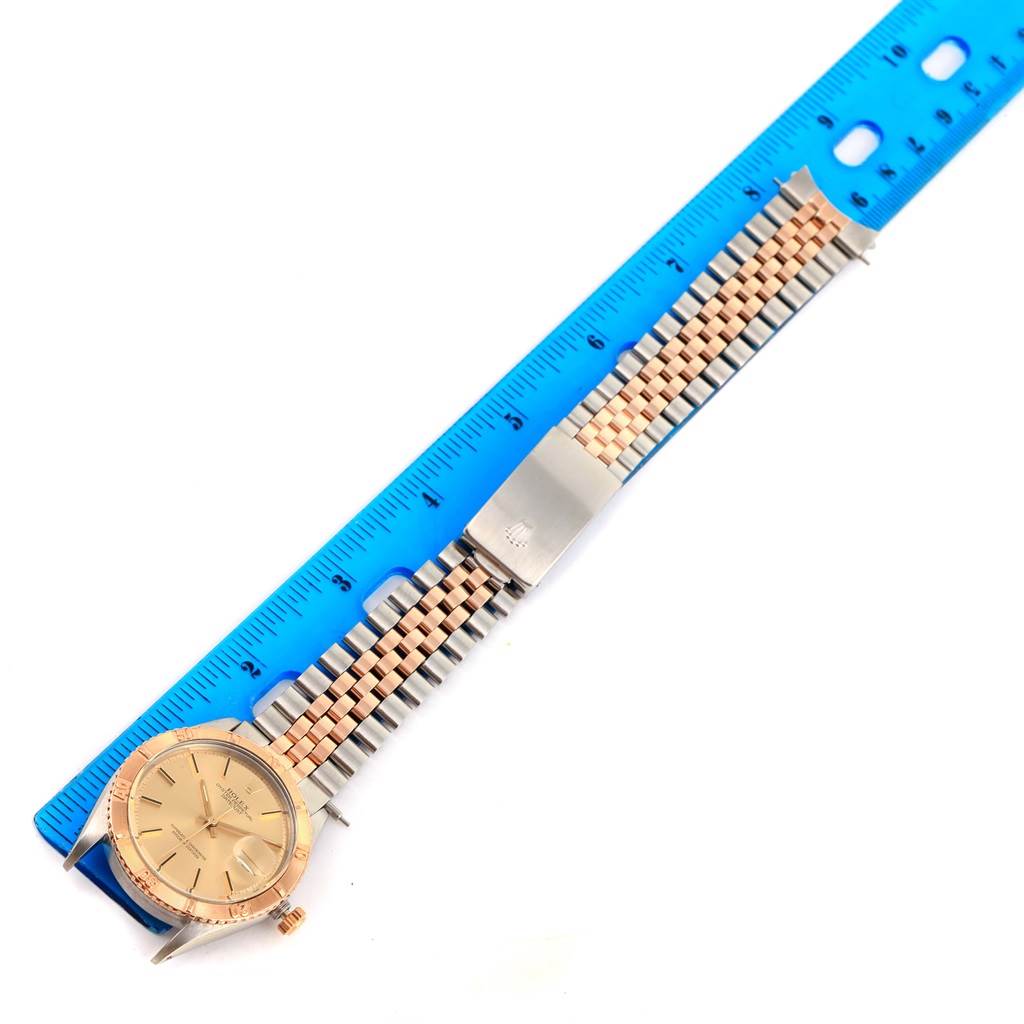 The image shows the Rolex Vintage Collection 16253 Men
s Steel and Gold (two tone) Champagne Dial 16253 Men
s Steel and Gold (two tone) Champagne Dial watch lying flat, displaying its entire face, band, and clasp alongside a ruler.