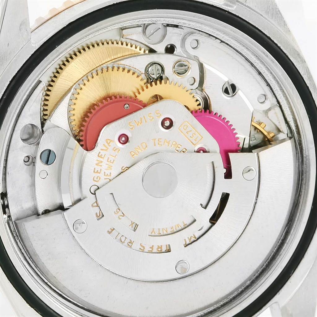 The image shows the internal mechanism of a Rolex Vintage Collection 16253 Men
s Steel and Gold (two tone) Champagne Dial 16253 Men
s Steel and Gold (two tone) Champagne Dial model watch, highlighting gears and the movement assembly.