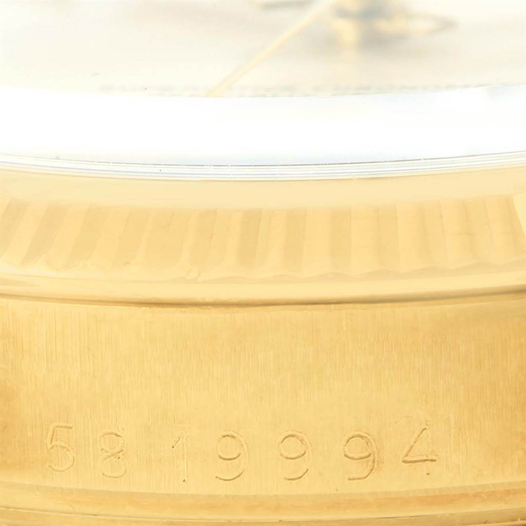 The image shows a close-up of the Rolex Vintage Collection 1503 Men's Yellow Gold Silver Dial 1503 Men's Yellow Gold Silver Dial watch, focusing on the serial number engraving on the case edge.