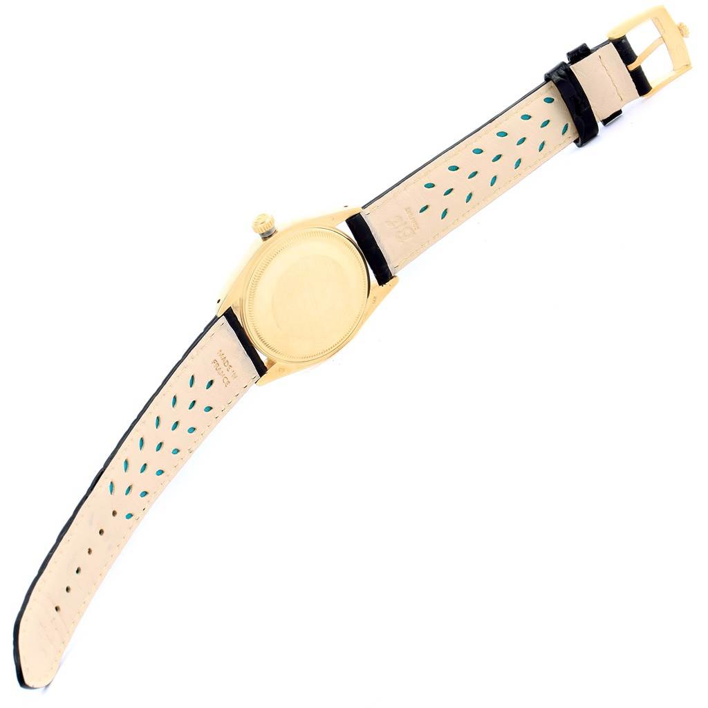 This image shows the back side of the Rolex Vintage Collection 1503 Men's Yellow Gold Silver Dial 1503 Men's Yellow Gold Silver Dial model, including the case, crown, and leather strap with buckle.