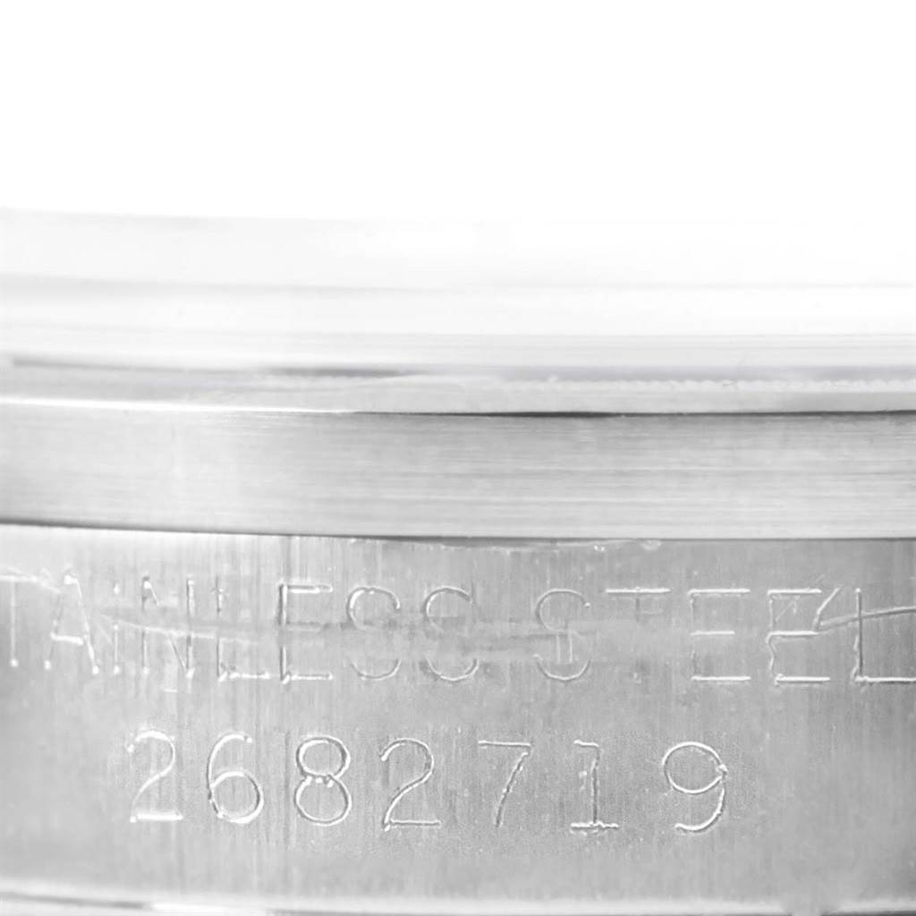 This image shows a close-up of the case side and engraved serial number of a Rolex Vintage Collection 1501 Men's Stainless Steel Blue Dial 1501 Men's Stainless Steel Blue Dial watch.