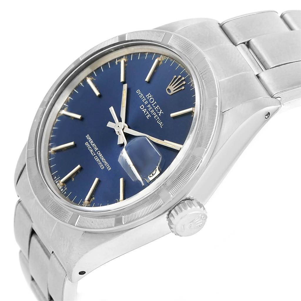 This image shows a Rolex Vintage Collection 1501 Men's Stainless Steel Blue Dial 1501 Men's Stainless Steel Blue Dial watch from a slight angled side view, featuring its blue dial, crown, and part of the bracelet.