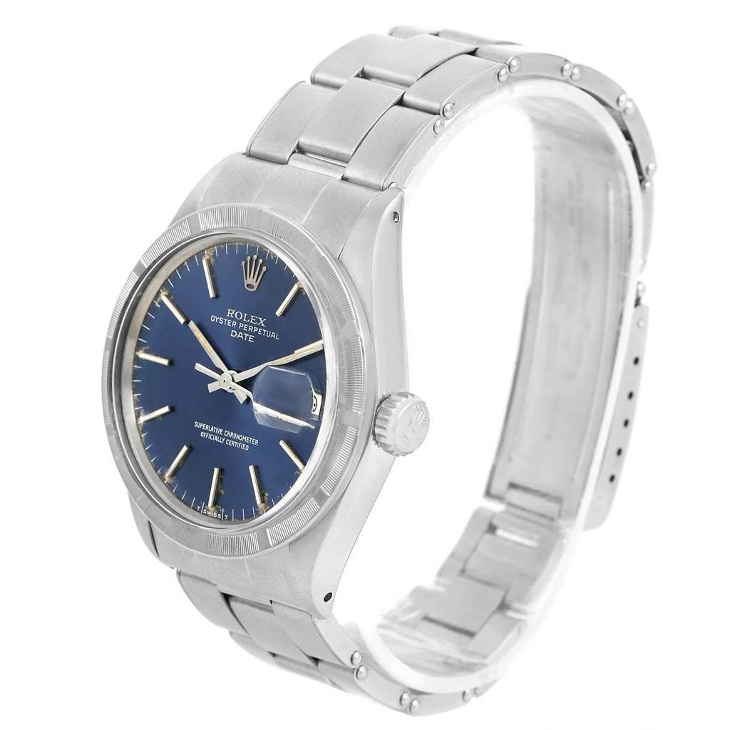 The image shows a side-angle view of a Rolex Vintage Collection 1501 Men's Stainless Steel Blue Dial 1501 Men's Stainless Steel Blue Dial Oyster Perpetual Date watch, highlighting its blue dial and metal bracelet.