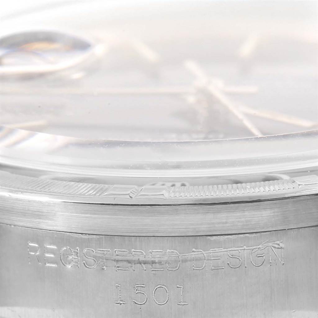 The image shows an angled close-up of the Rolex Vintage Collection 1501 Men's Stainless Steel Blue Dial 1501 Men's Stainless Steel Blue Dial watch, highlighting the outer case with "REGISTERED DESIGN 1501" engraved.