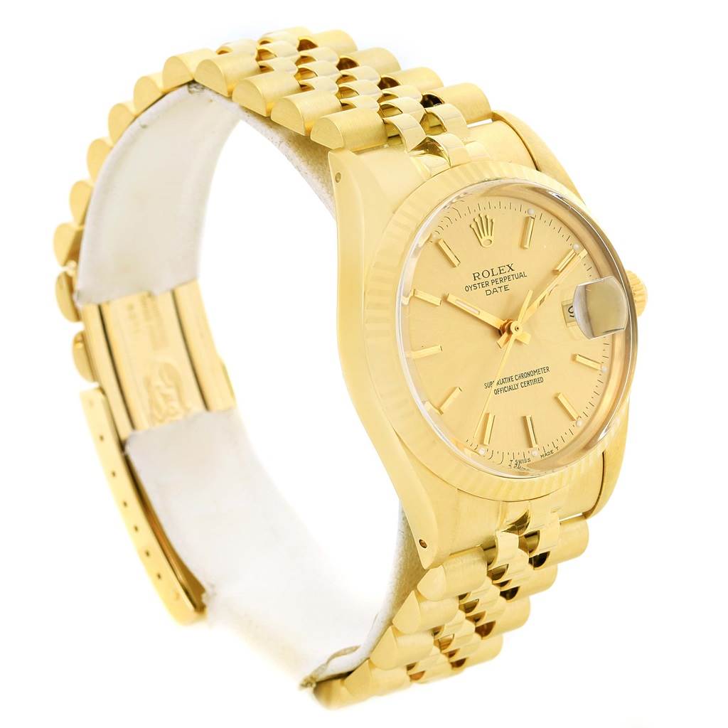The image shows a side angle of a gold Rolex Vintage Collection 15037 Men's Yellow Gold Champagne Dial 15037 Men's Yellow Gold Champagne Dial watch, highlighting its bracelet, dial, and clasp.